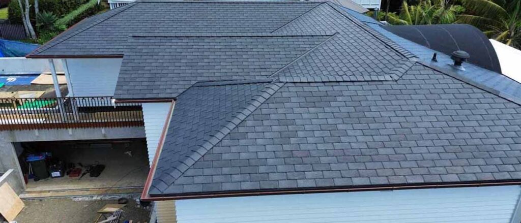 Three tab asphalt shingle roof on a weatherboard villa in Auckland